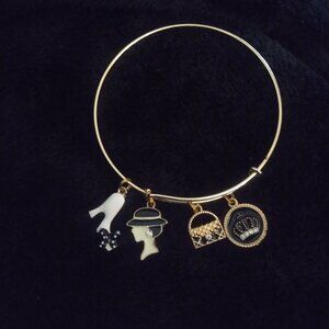 Elegant Goldtone Charm Bracelet with High Heel, Fashion Hat, Purse, and Crown